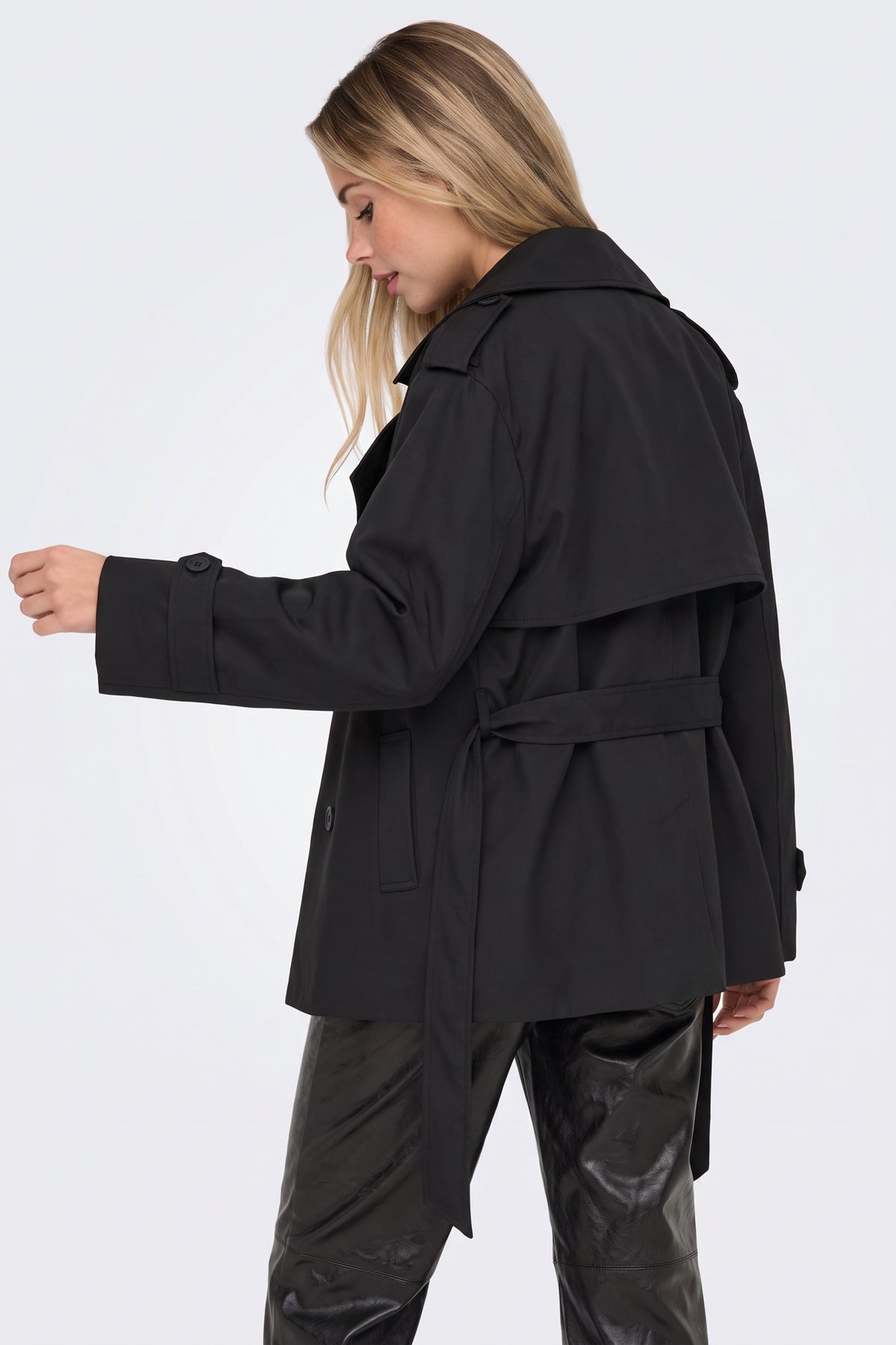 Black wrap trench jacket side view on model