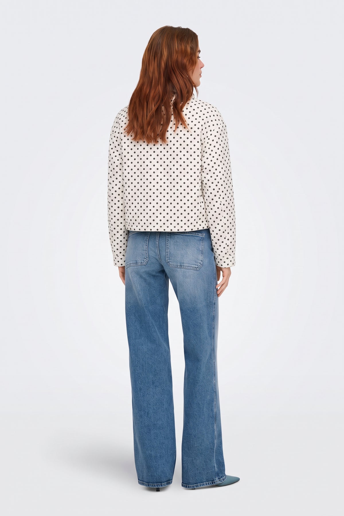Cream polka dot cropped jacket back view on model