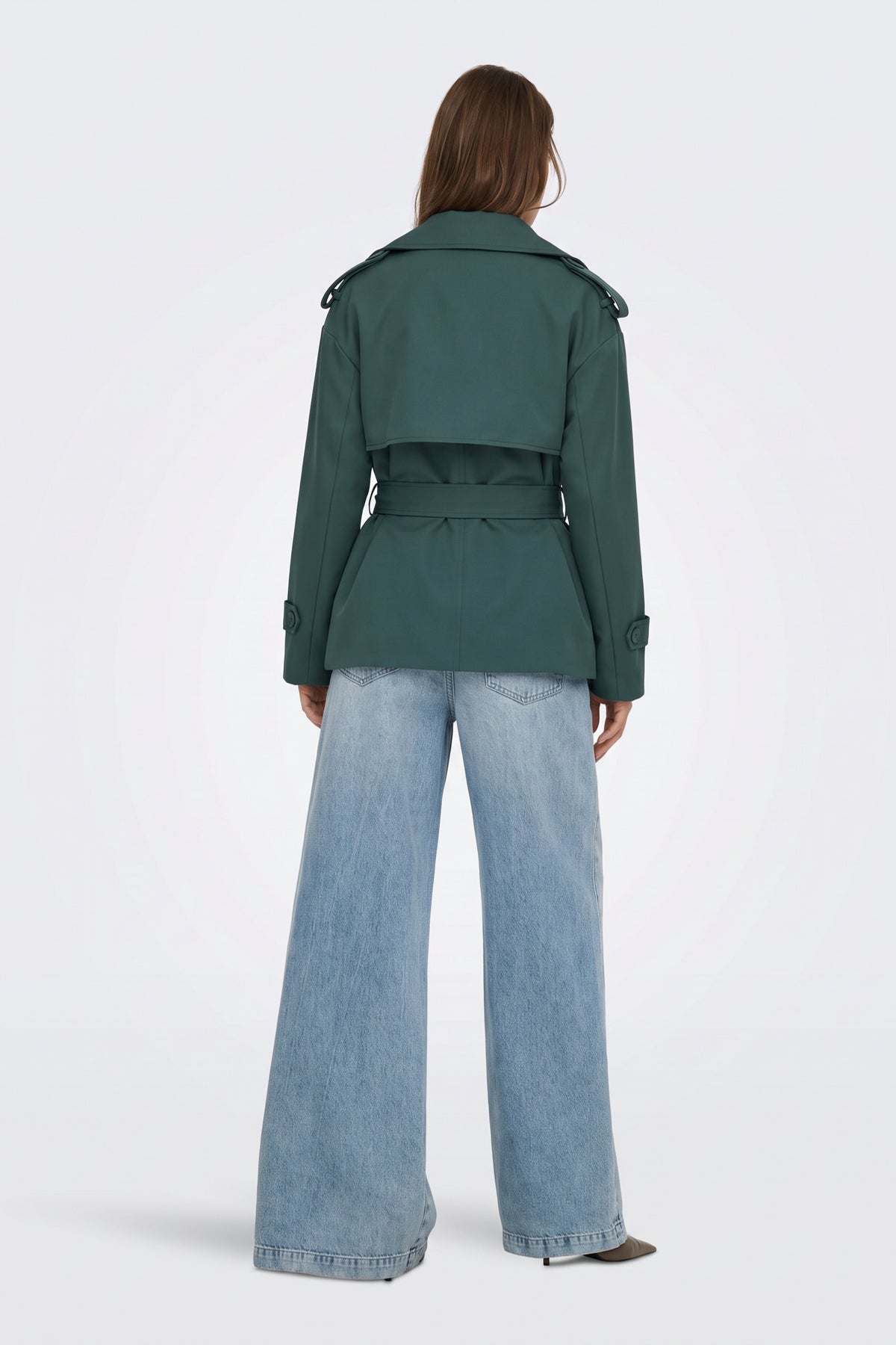 Green short trench jacket back view with storm flap