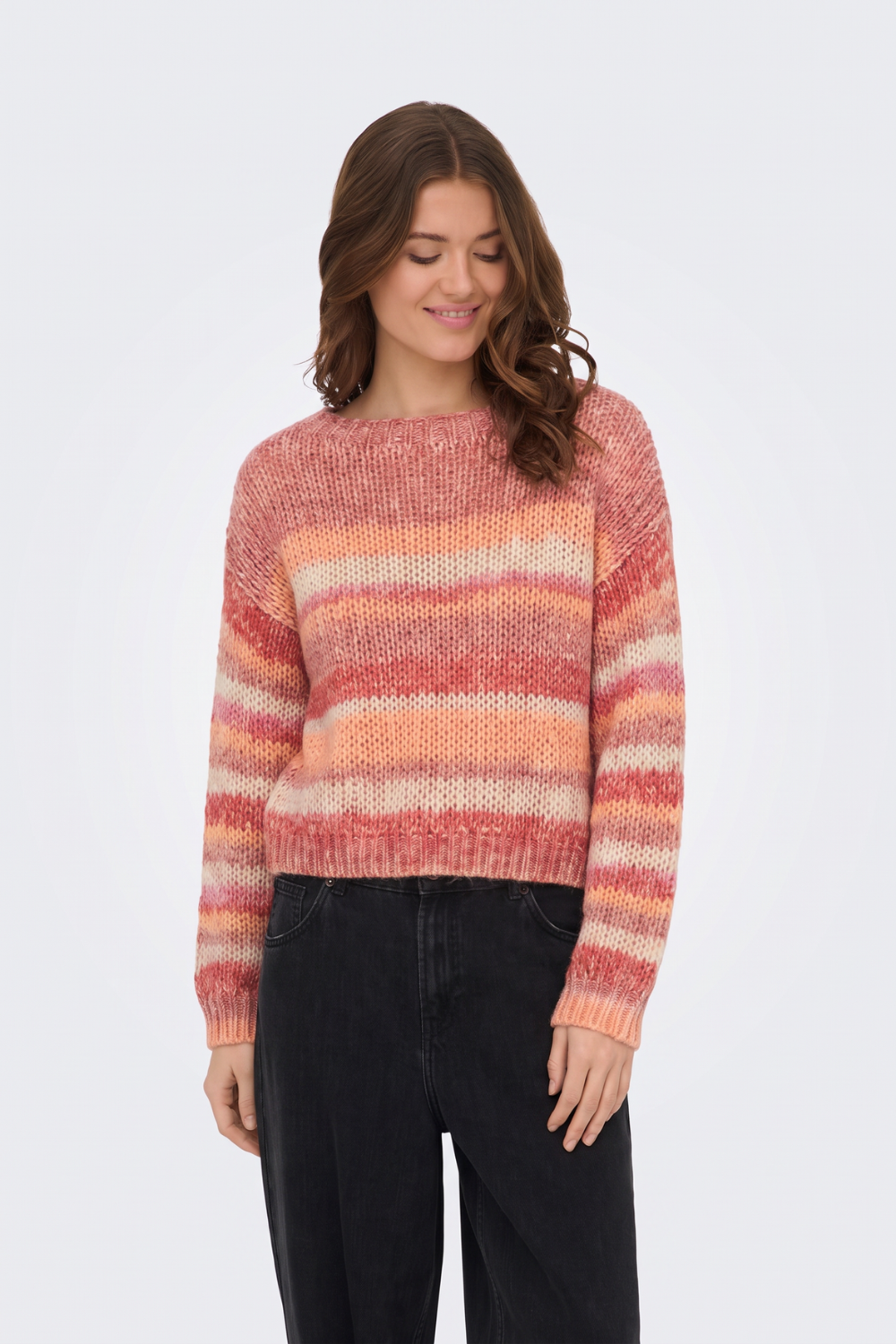 Multi stripe chunky knit jumper with black wide-leg jeans, on model