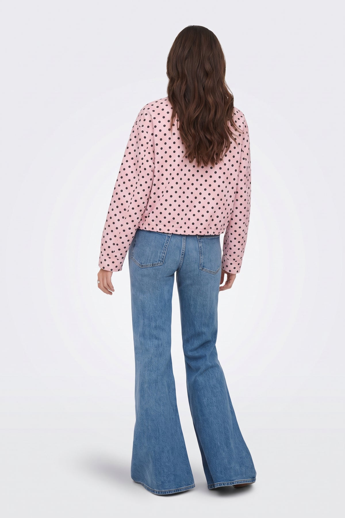Pink polka dot cropped jacket back view on model