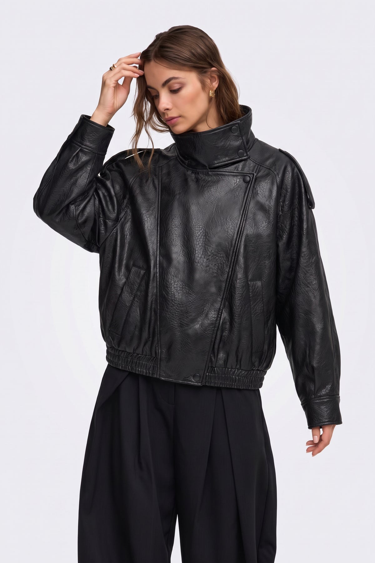 Black faux leather jacket with tall funnel collar, on model