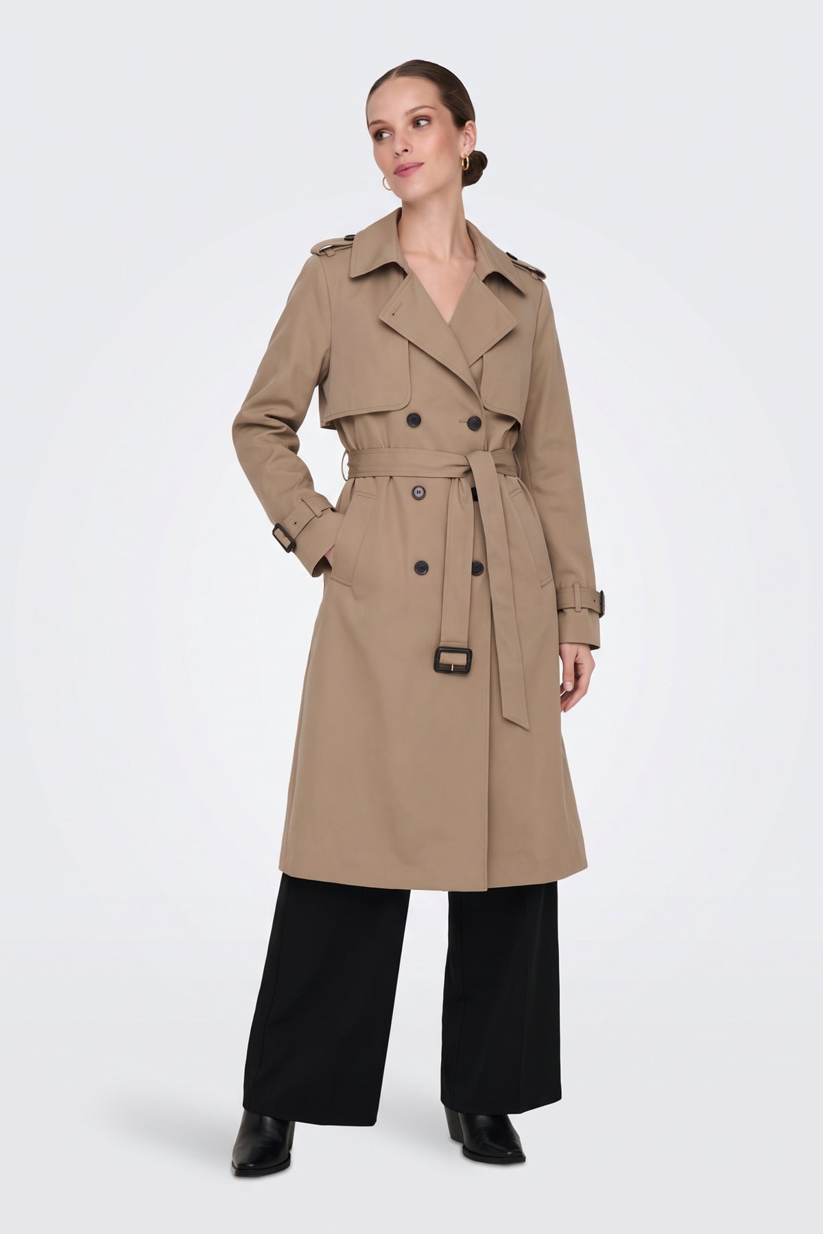 Camel long trench coat worn belted at the waist