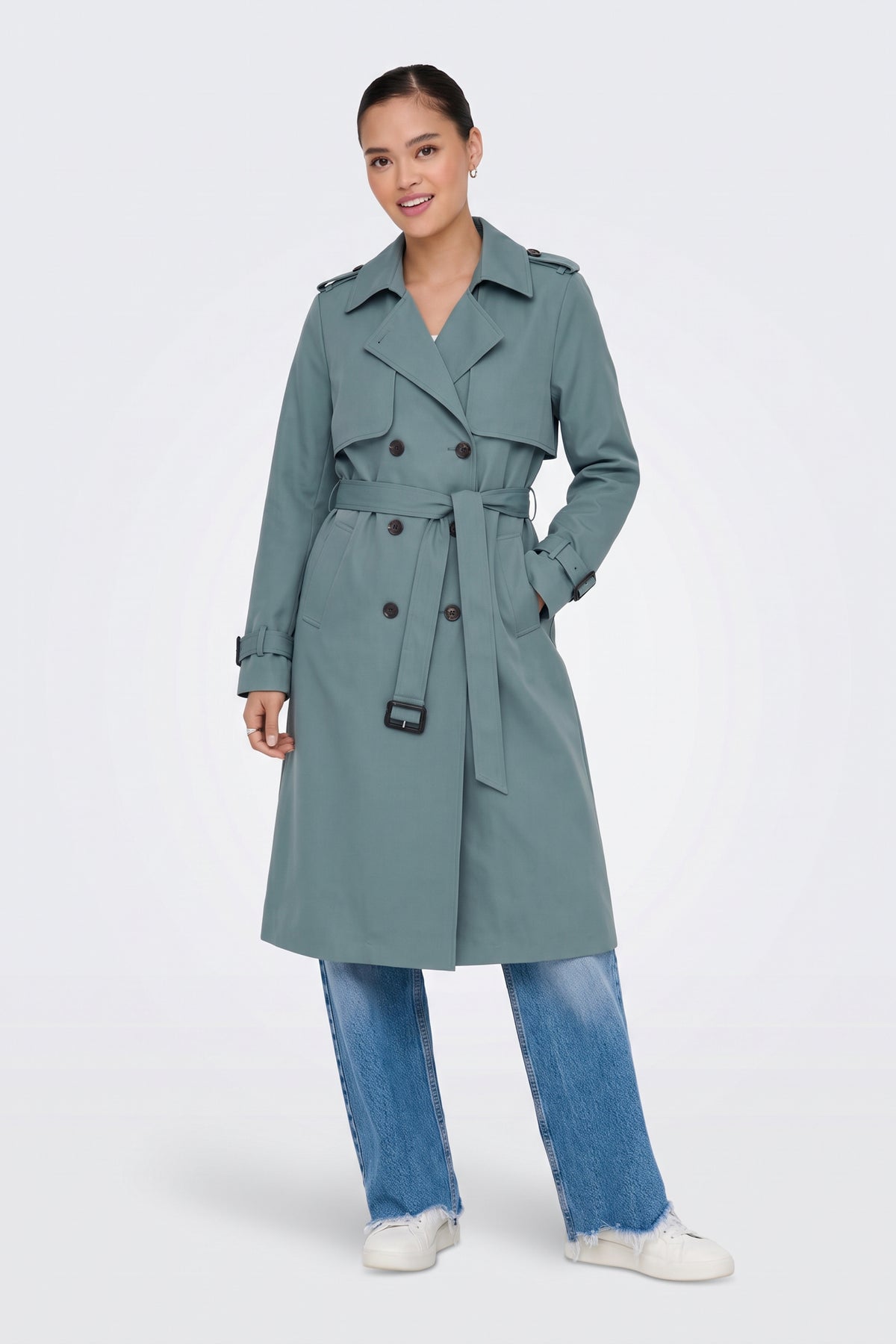 Sage long trench coat worn belted at the waist