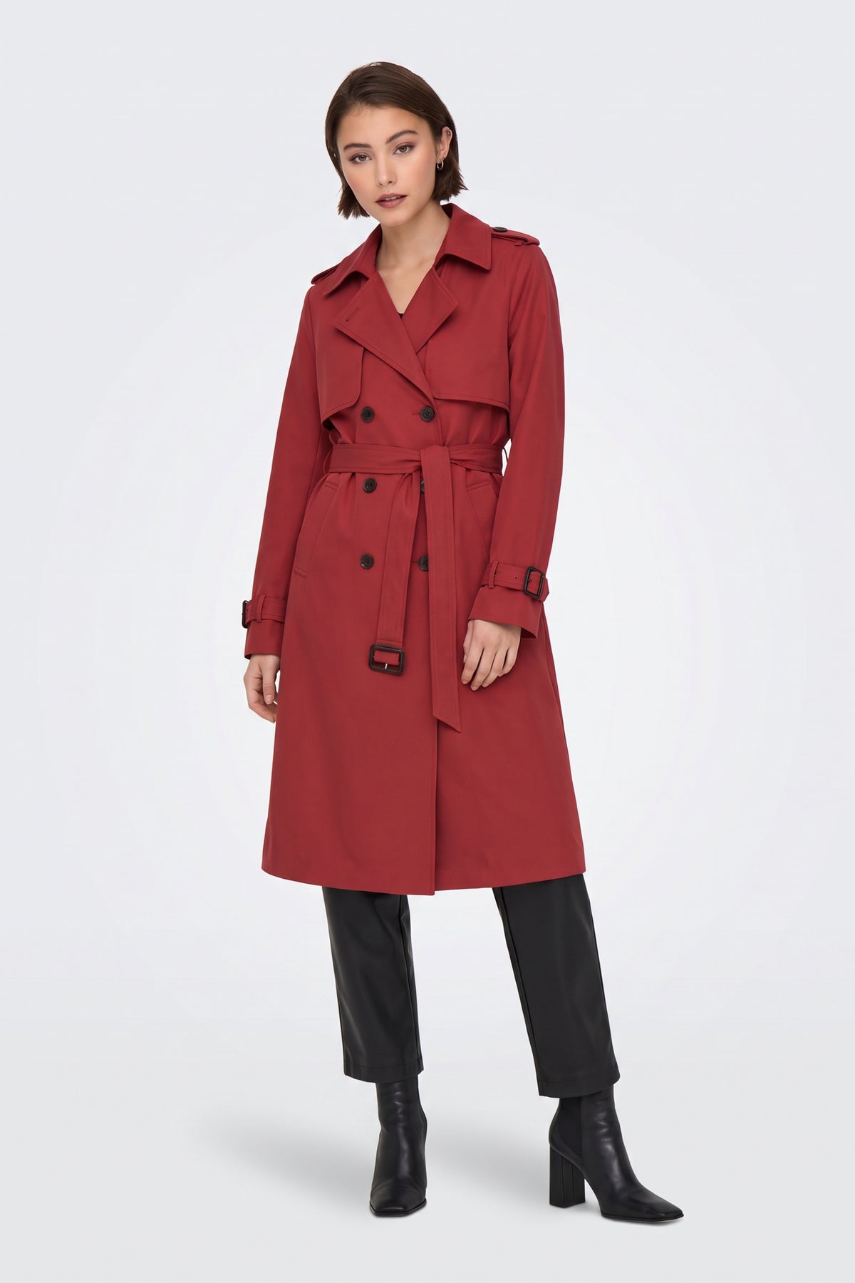Red long trench coat side view on model