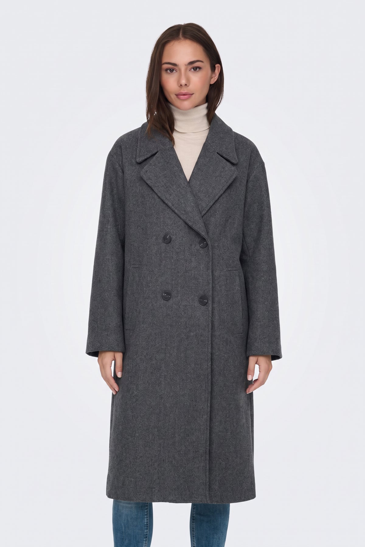 Dark grey long double-breasted coat over a cream roll neck, on model