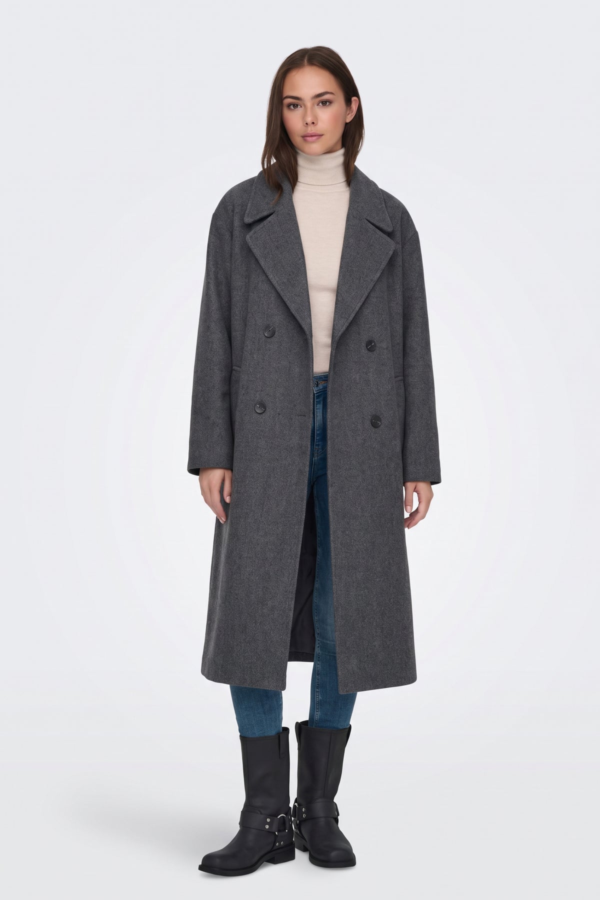 Dark grey oversized long coat worn open with jeans and boots, full length