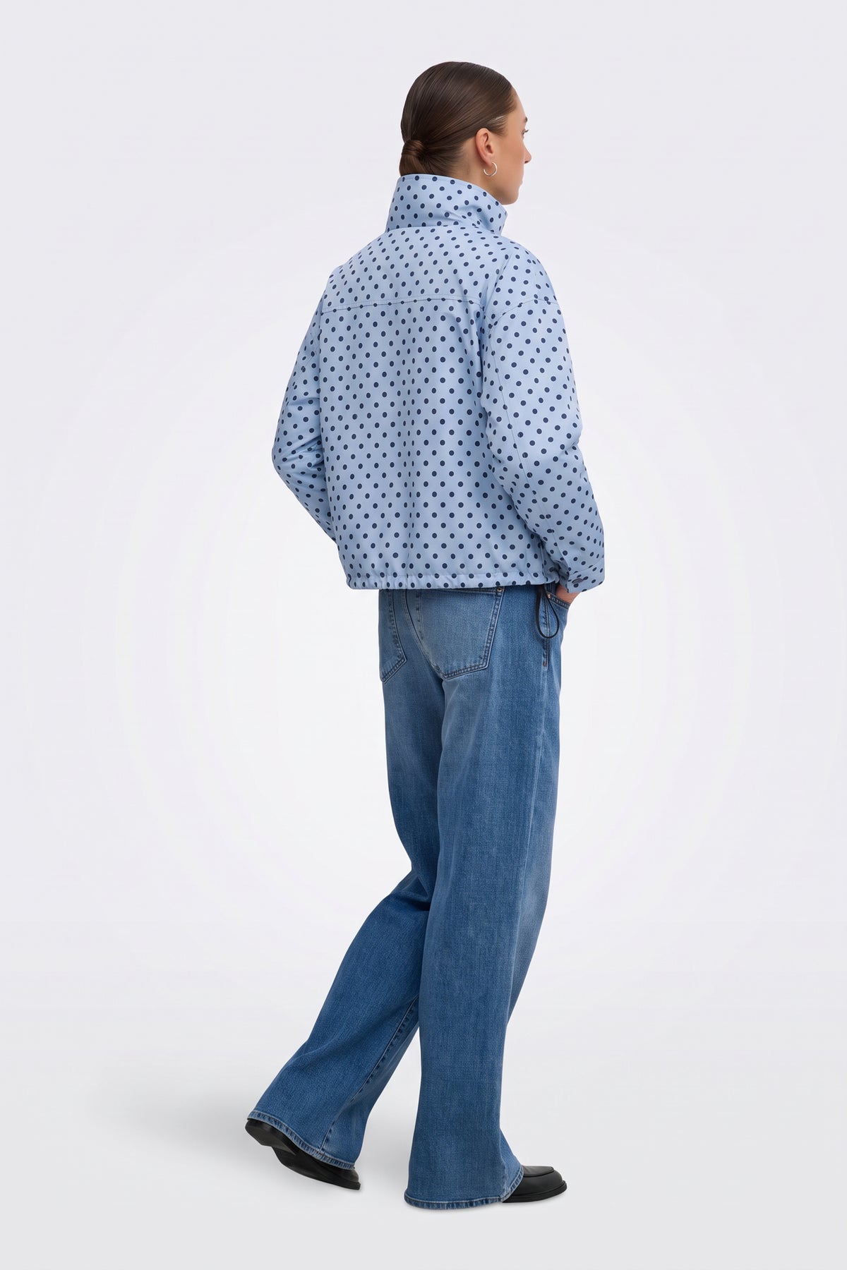 Light blue polka dot puffer jacket back view on model