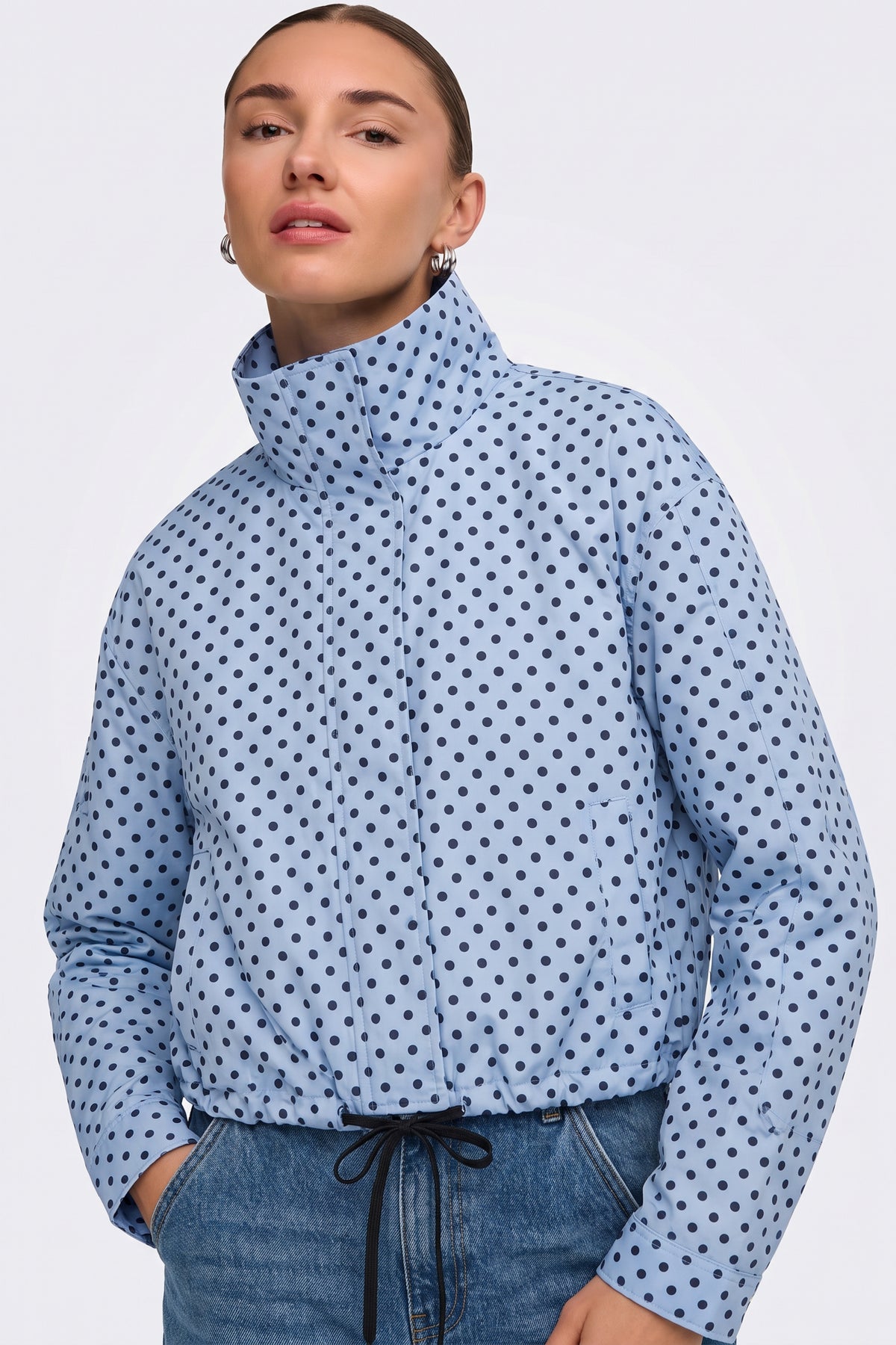 Light blue polka dot puffer jacket funnel collar, on model