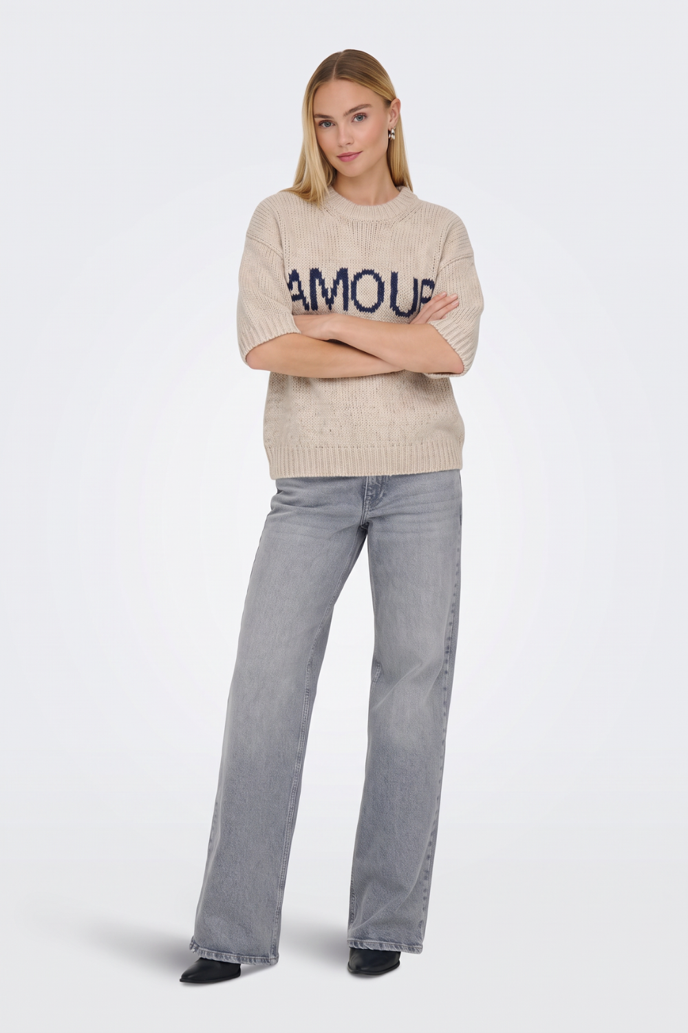Beige short sleeve jumper with grey wide-leg jeans, full length