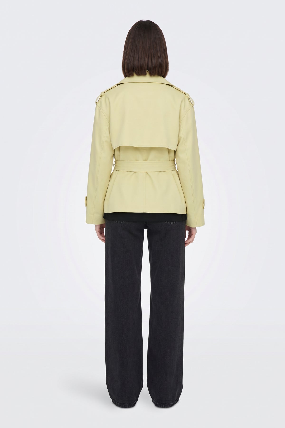 Yellow short trench jacket back view with storm flap