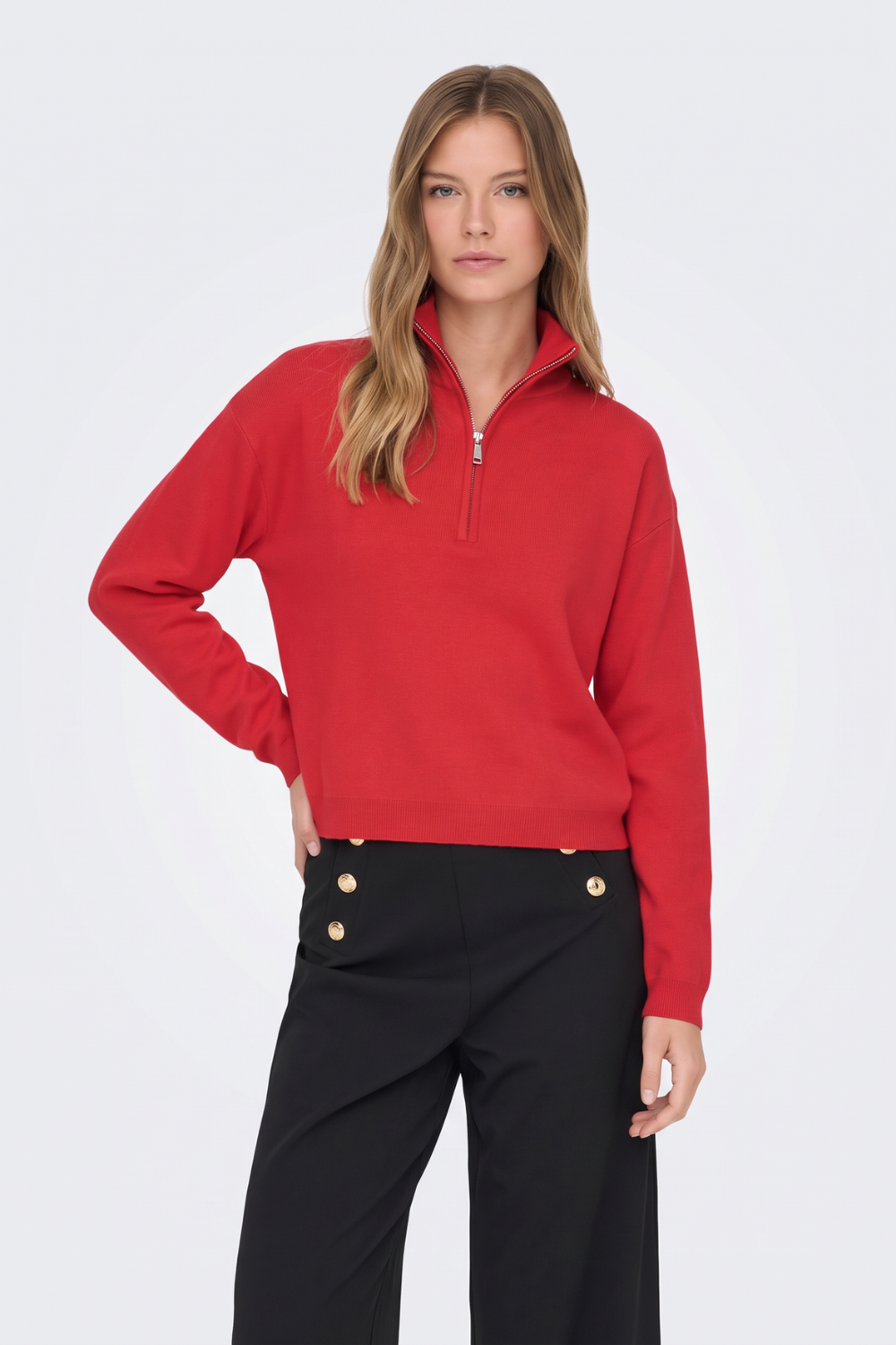 Red half zip knit jumper with black wide-leg trousers, on model