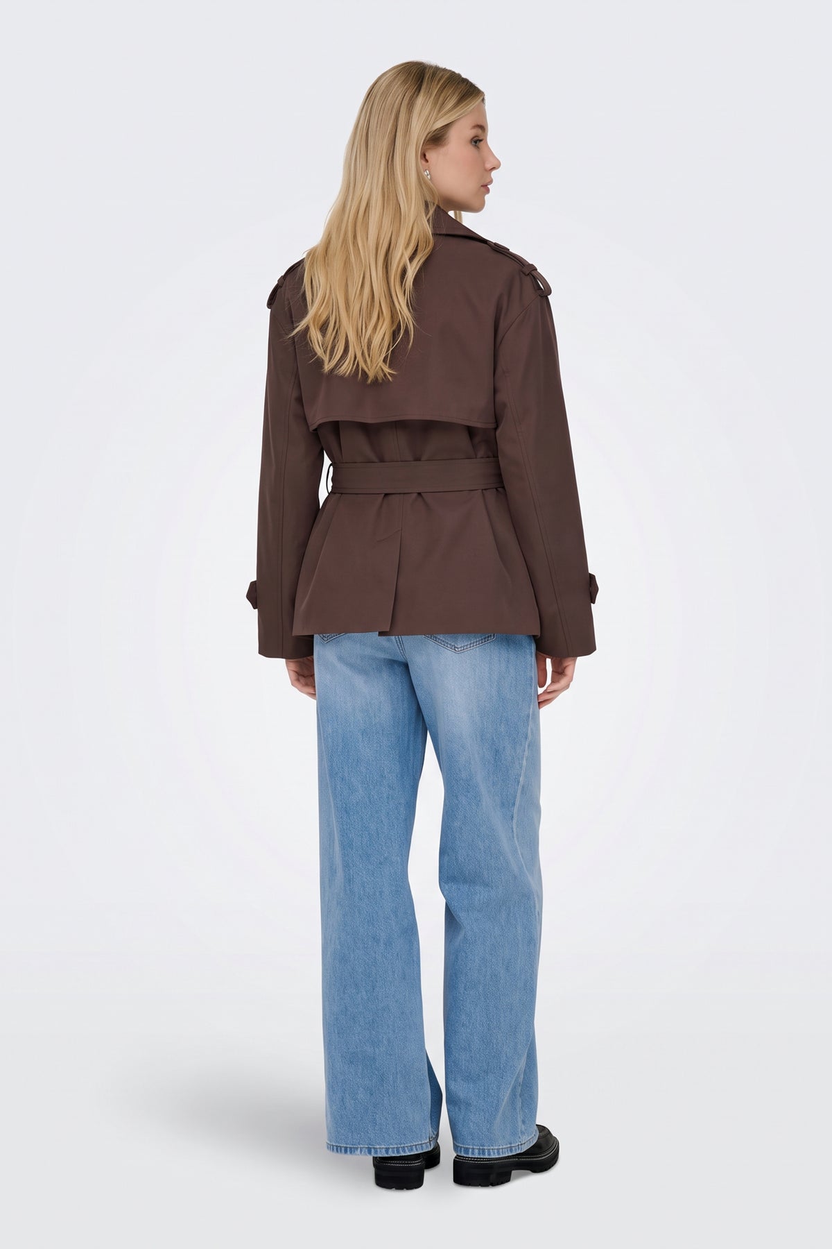 Brown short trench jacket back view with storm flap