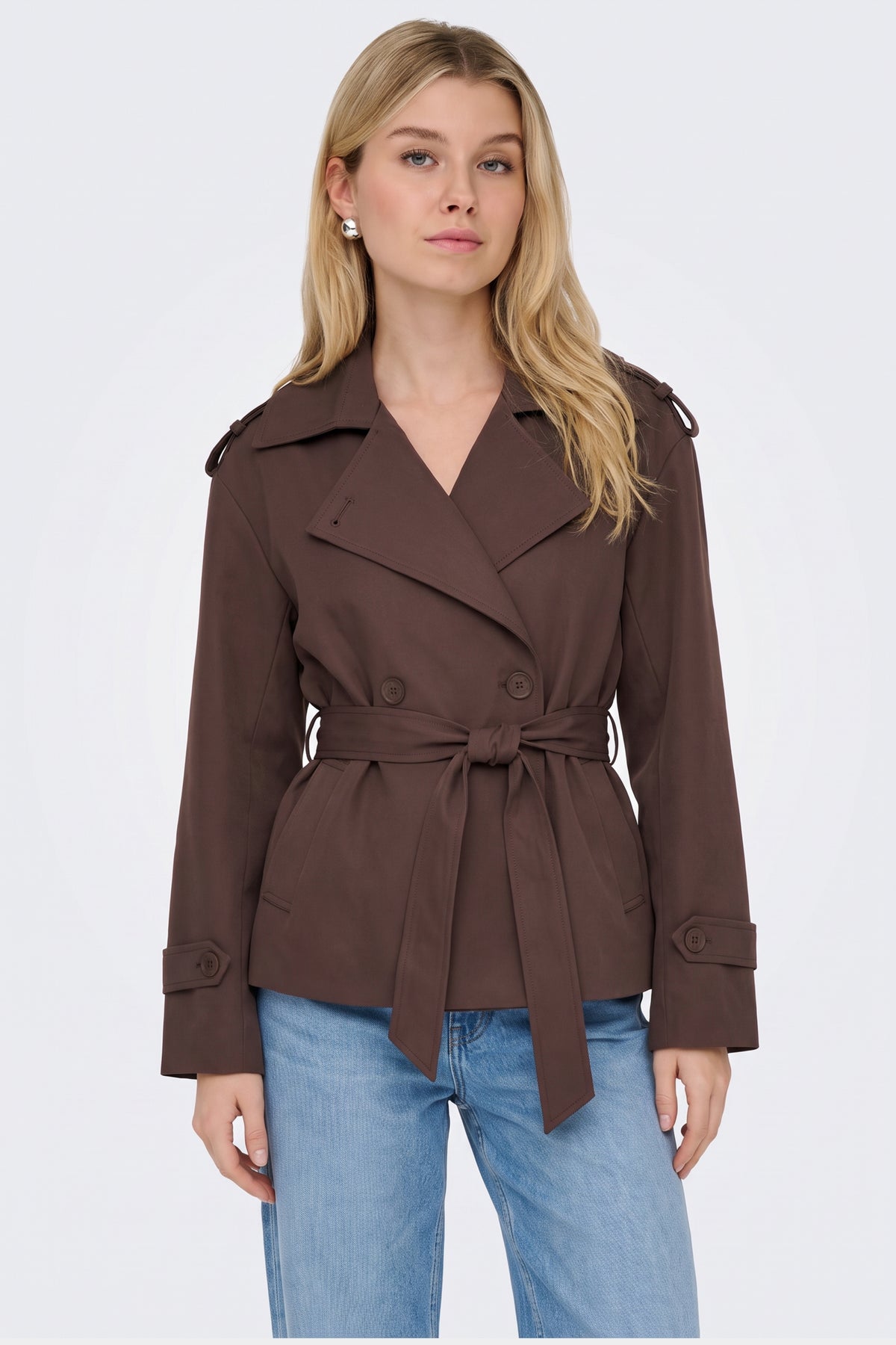 Brown trench jacket lapel and belt detail