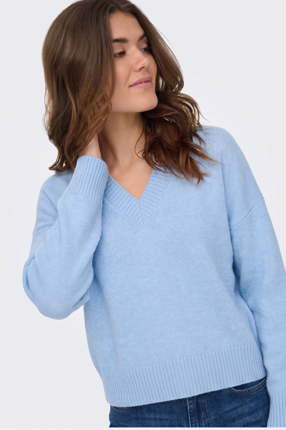 Light blue V neck knit jumper, on model