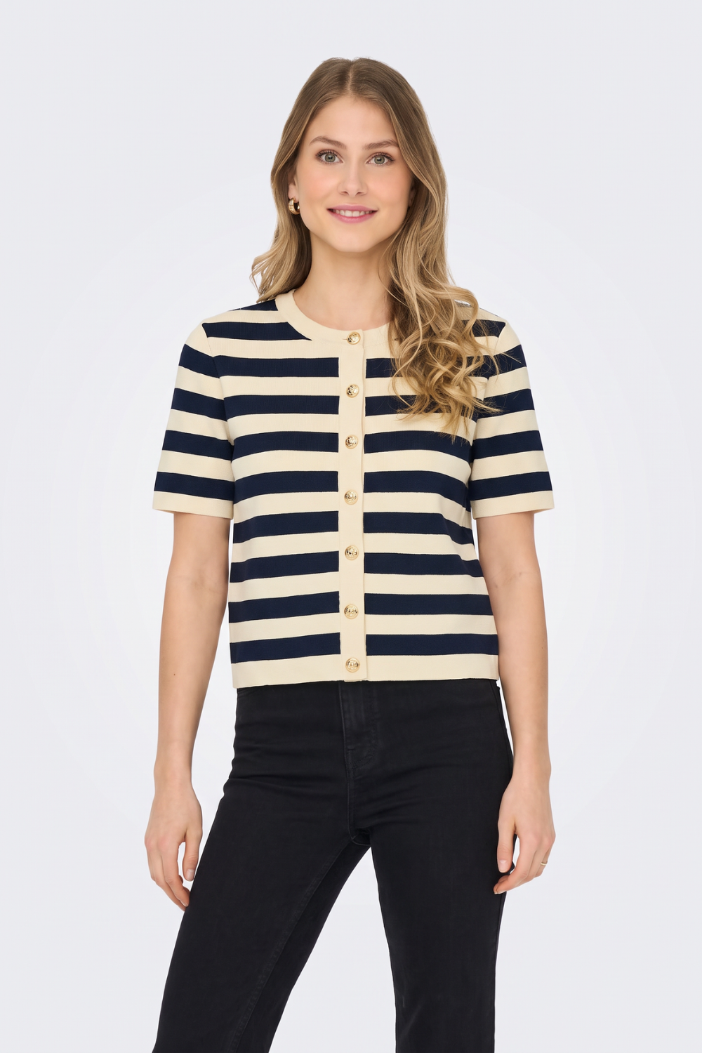 Cream and navy striped short sleeve cardigan with black jeans, on model