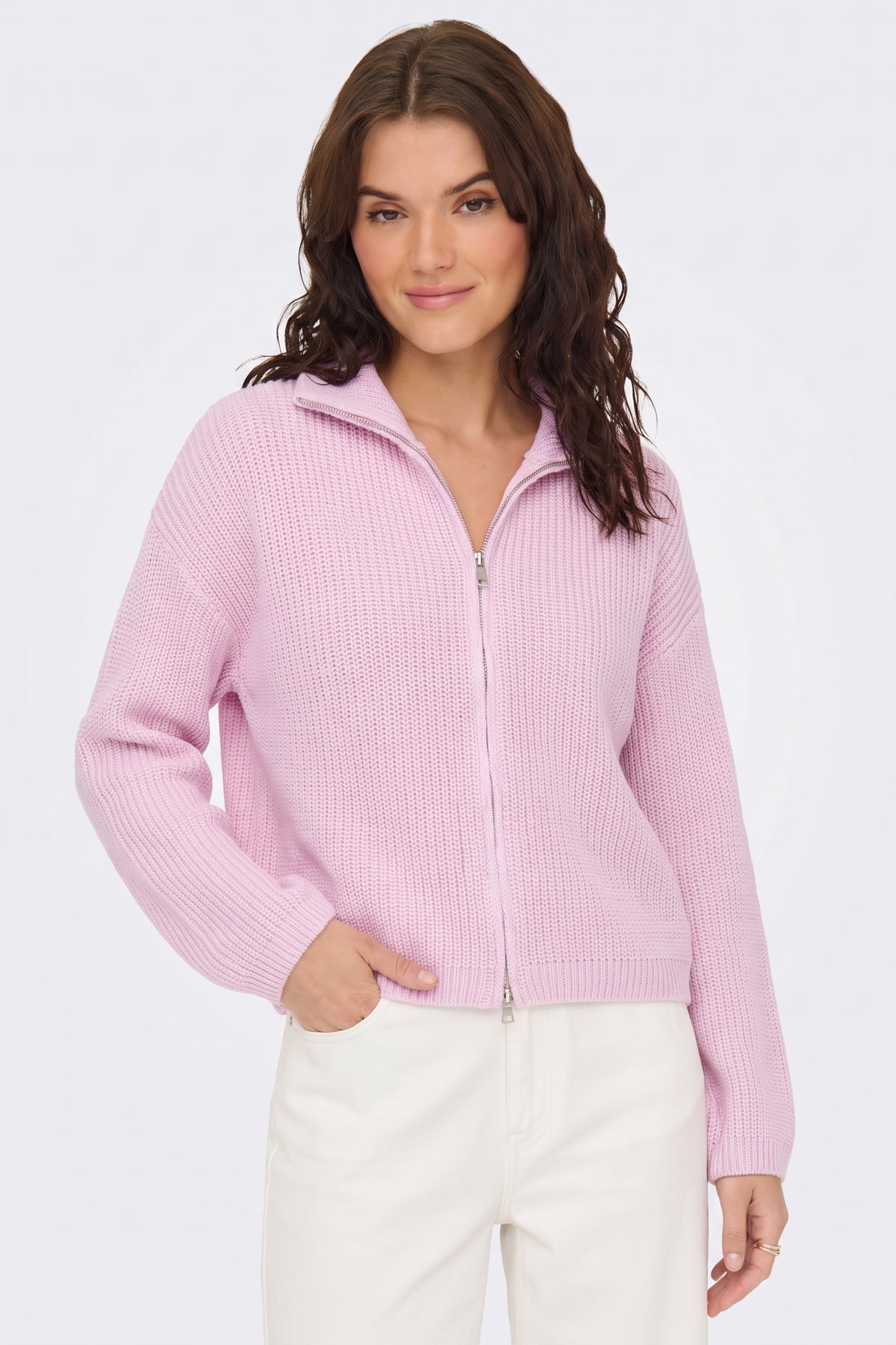 Pink piece styled with denim on model