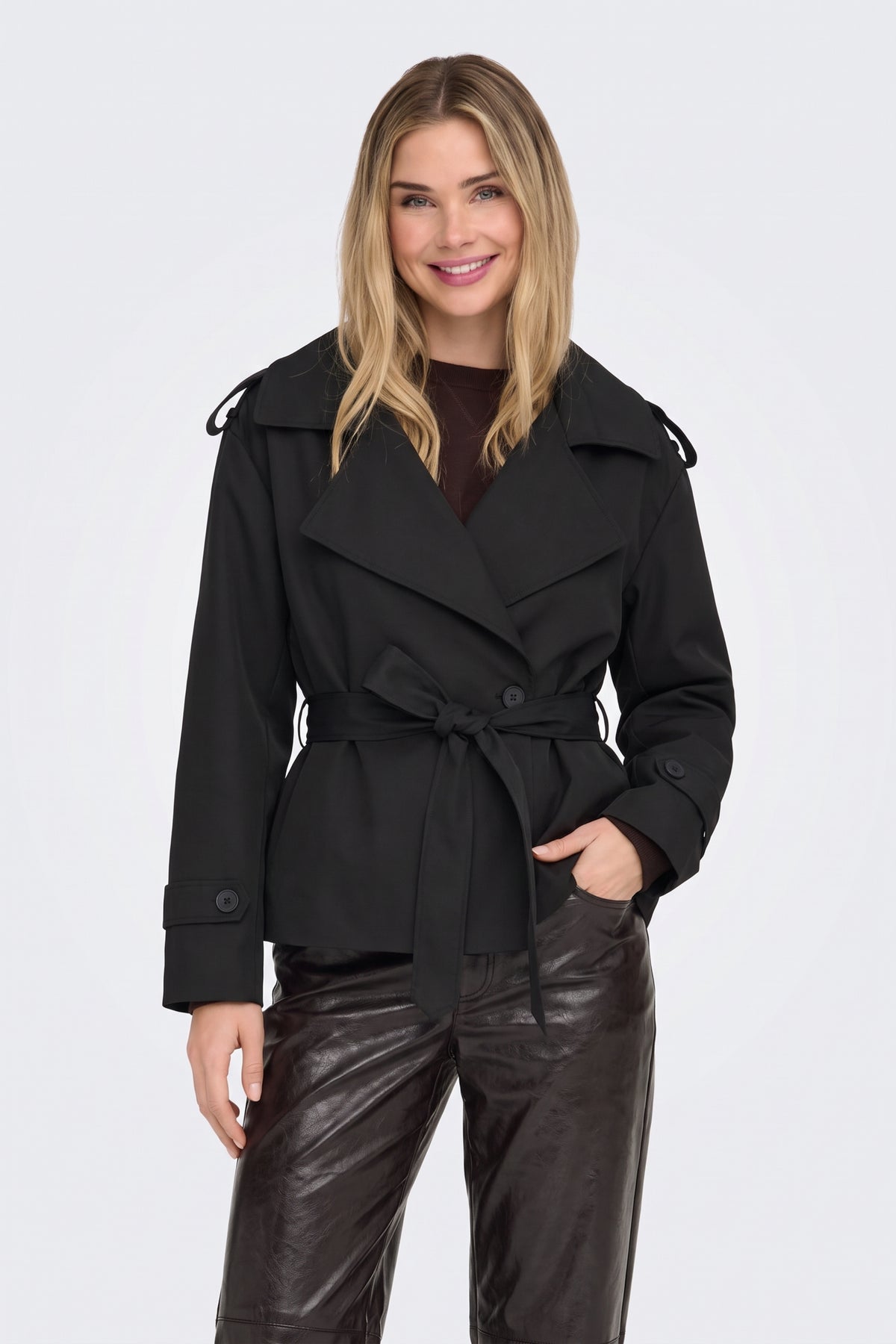 Black trench jacket lapel and belt detail