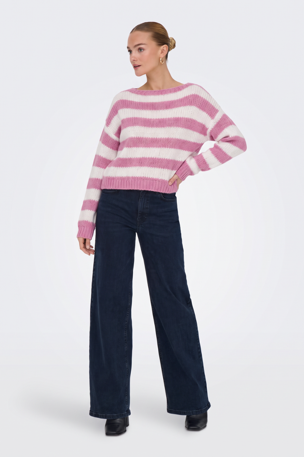 Pink striped cropped jumper with wide-leg jeans, full length
