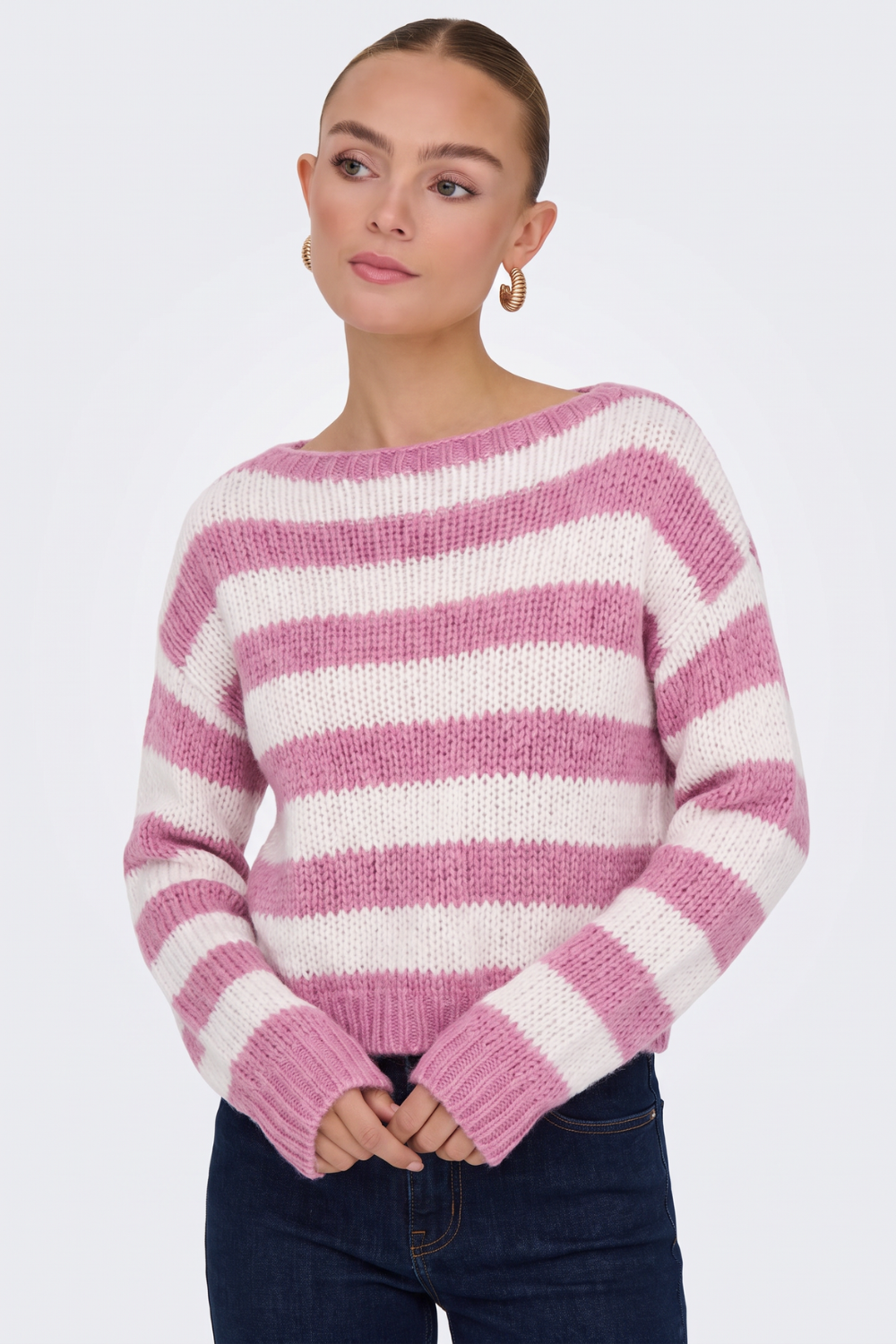 Pink striped jumper with wide boat neck, close-up on model