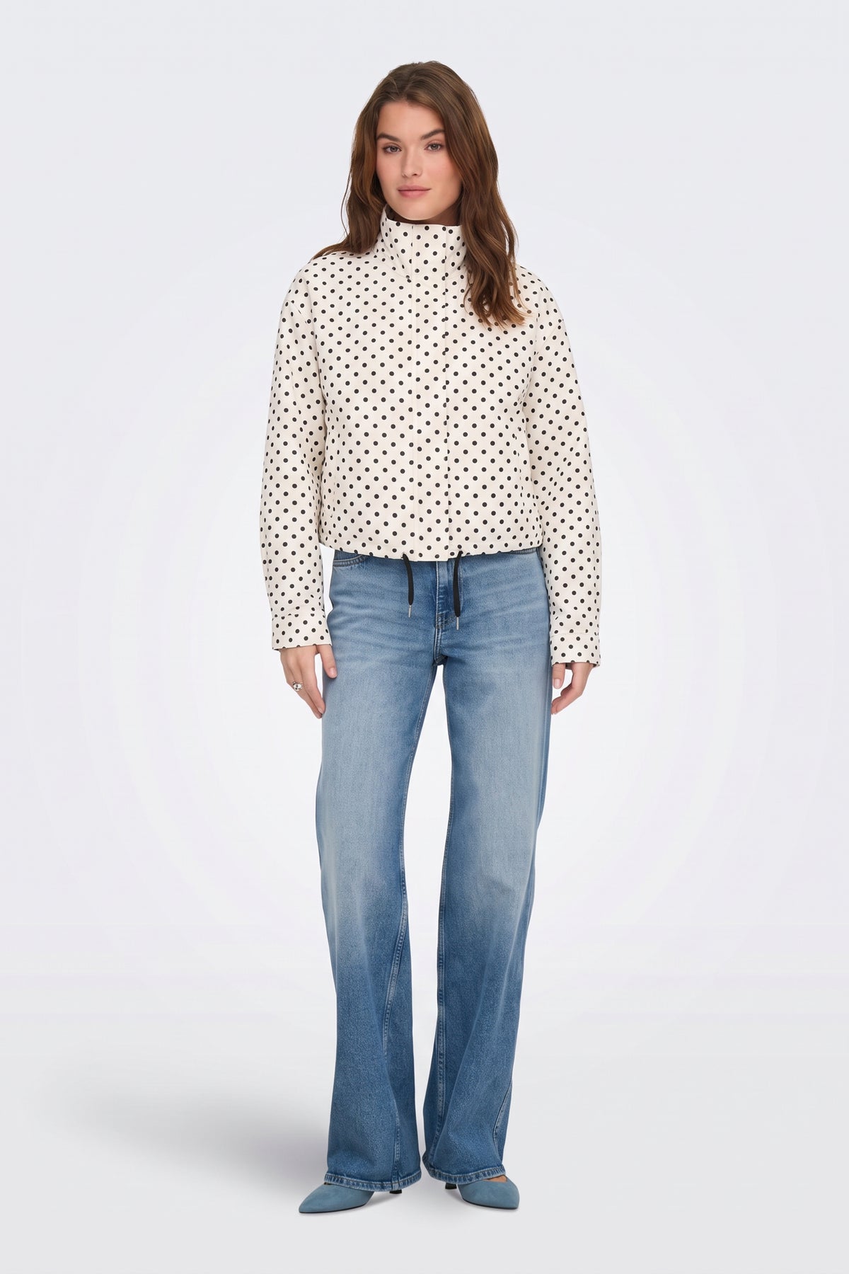 Cream polka dot cropped jacket, full length on model