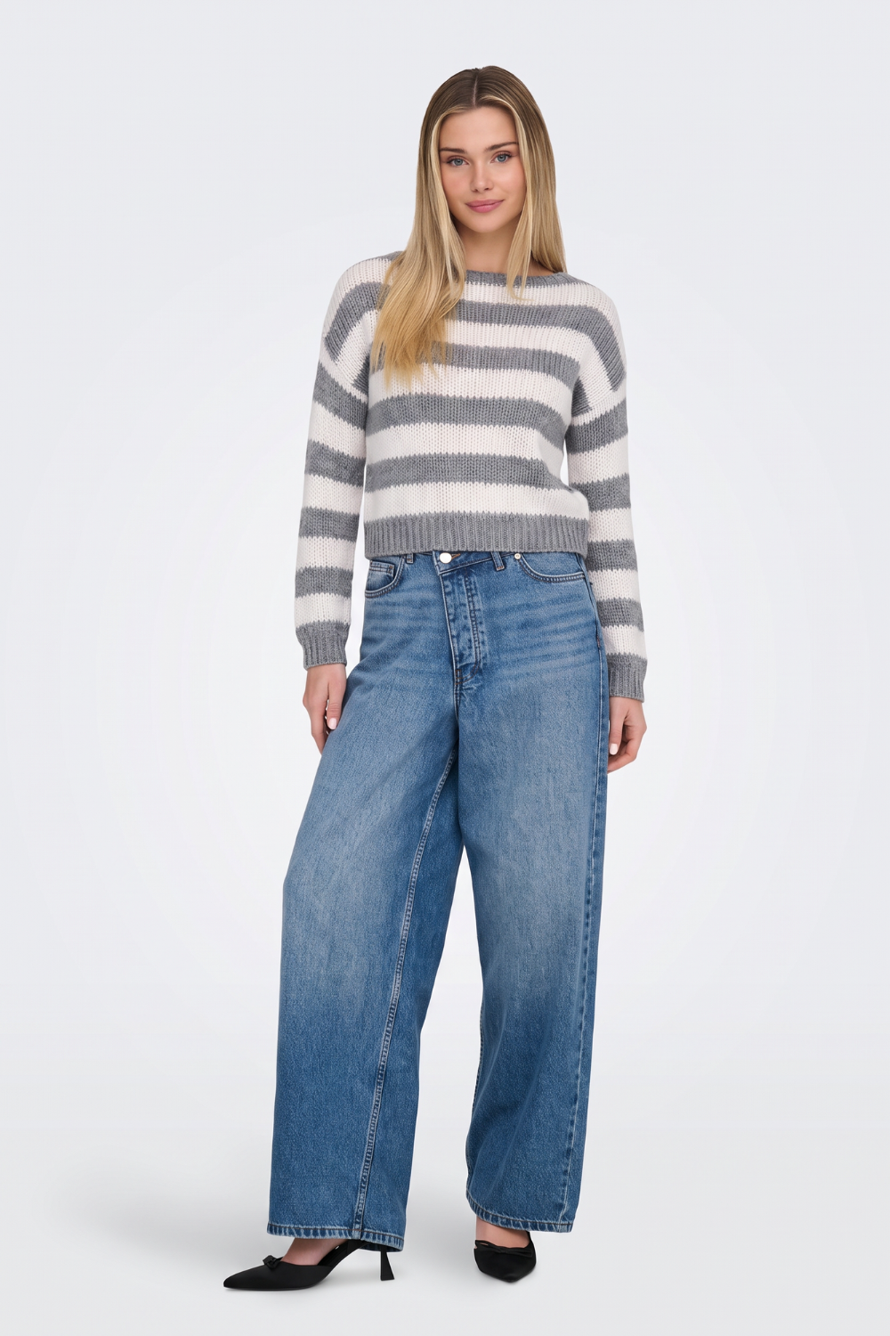 Grey striped cropped jumper with wide-leg jeans, full length