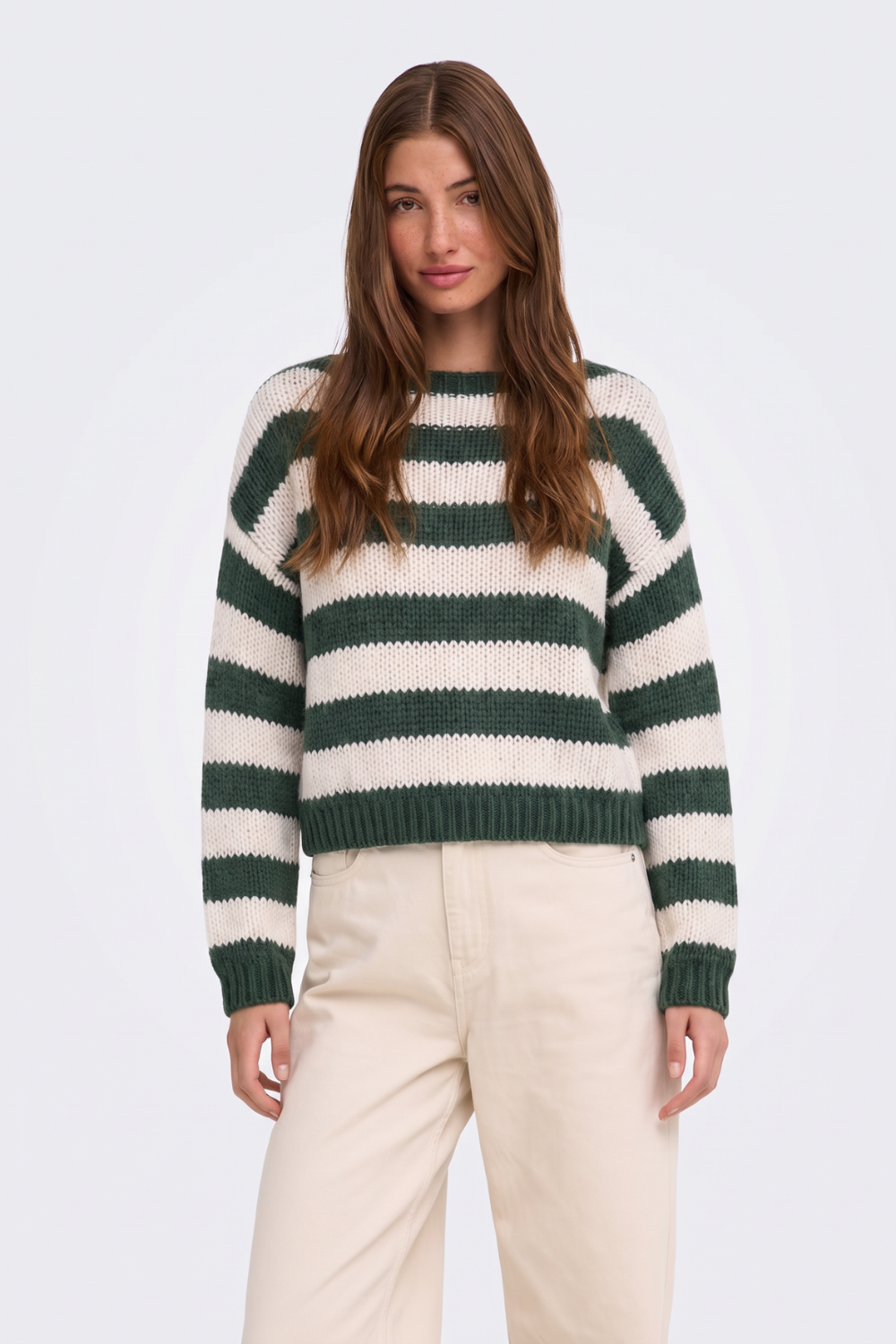 Green and cream striped chunky knit jumper, on model