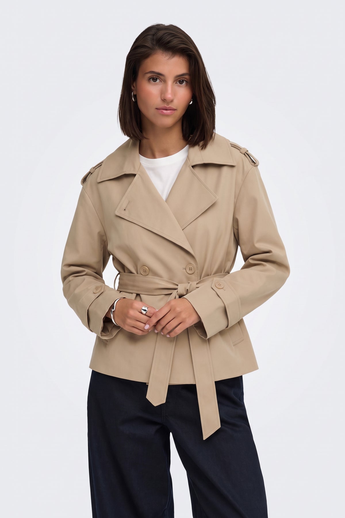 Camel short belted trench jacket on model, front view