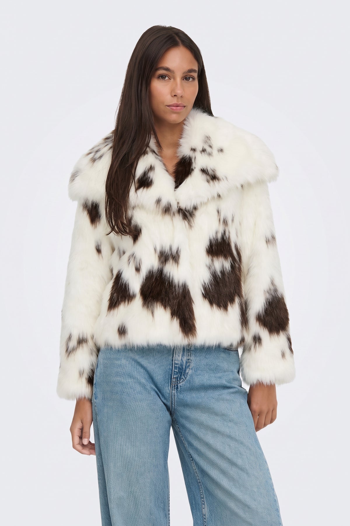 Faux Fur Jacket Cream Cow Print Cropped on model, front view