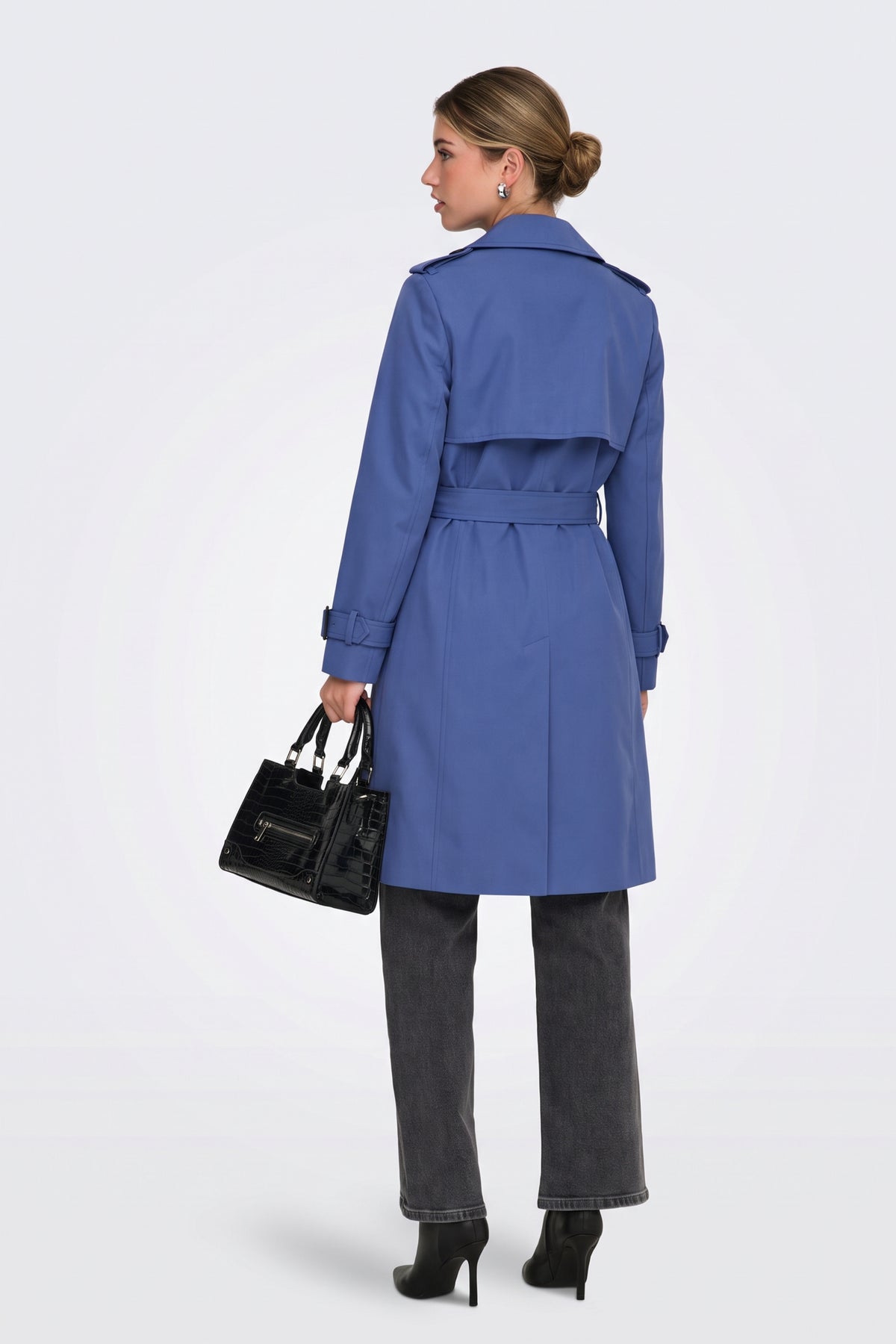 Blue long trench coat back view with storm flap