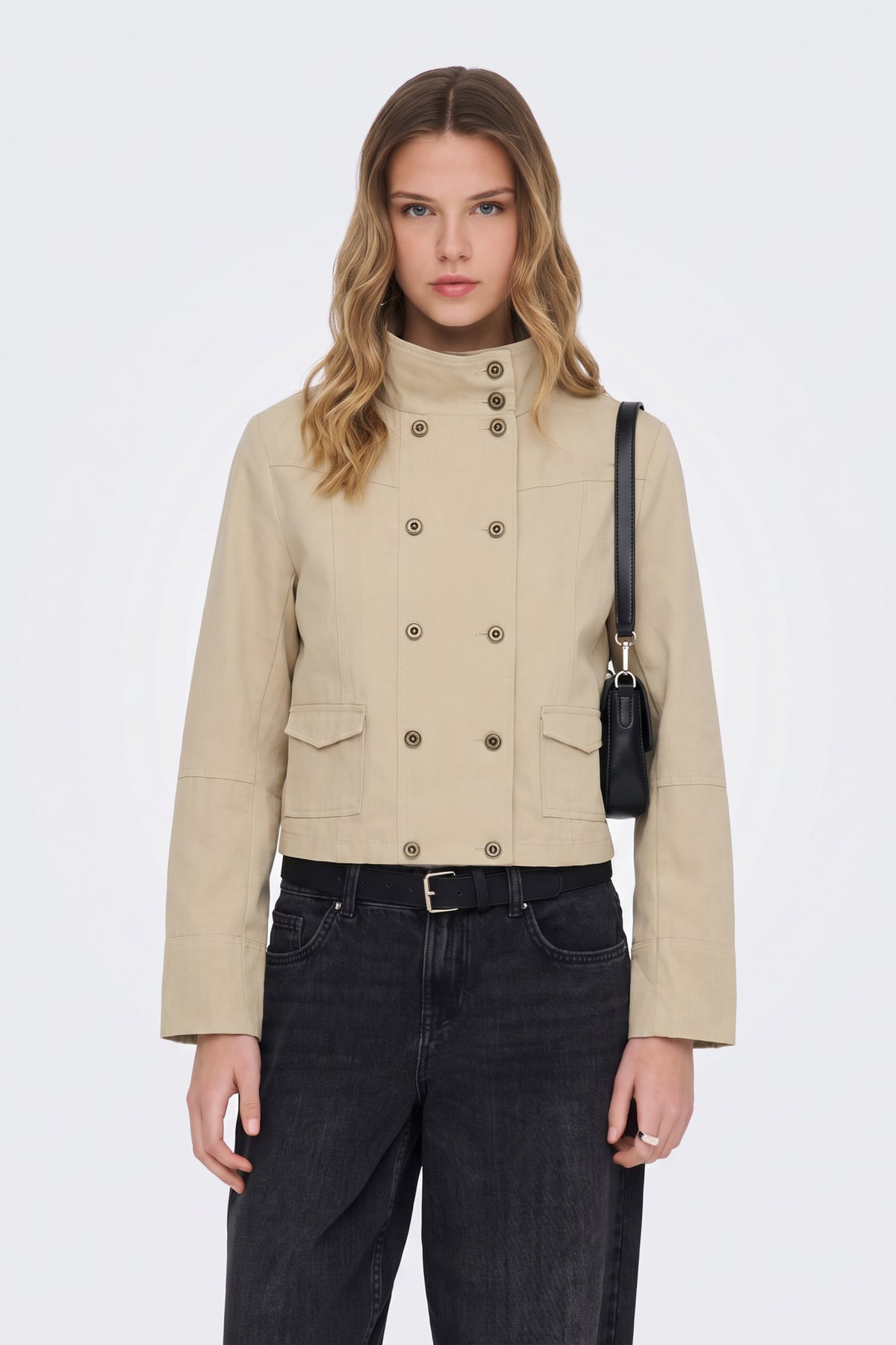 Beige cropped jacket with funnel neck and double-breasted buttons, on model