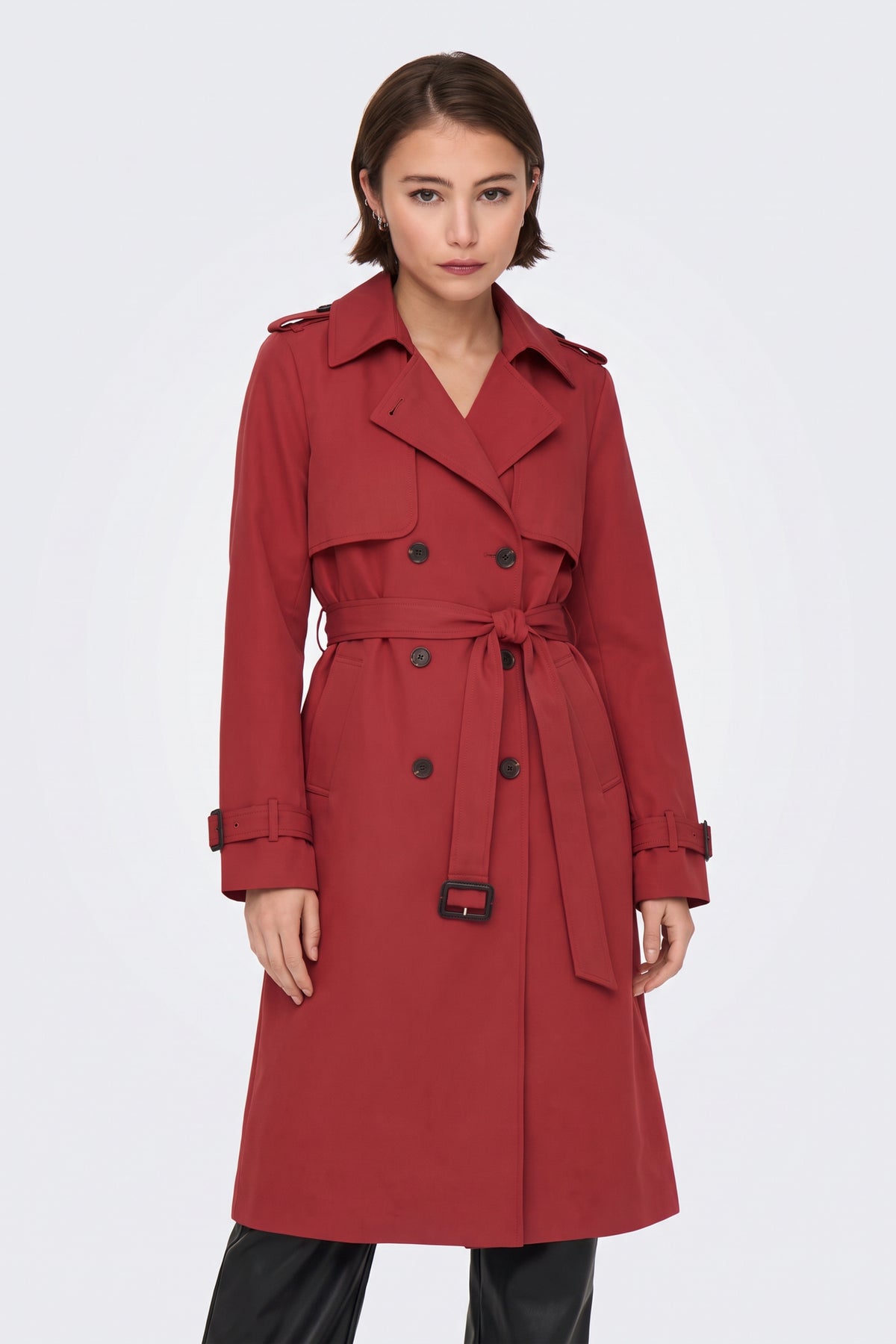 Red belted trench coat on model, front view
