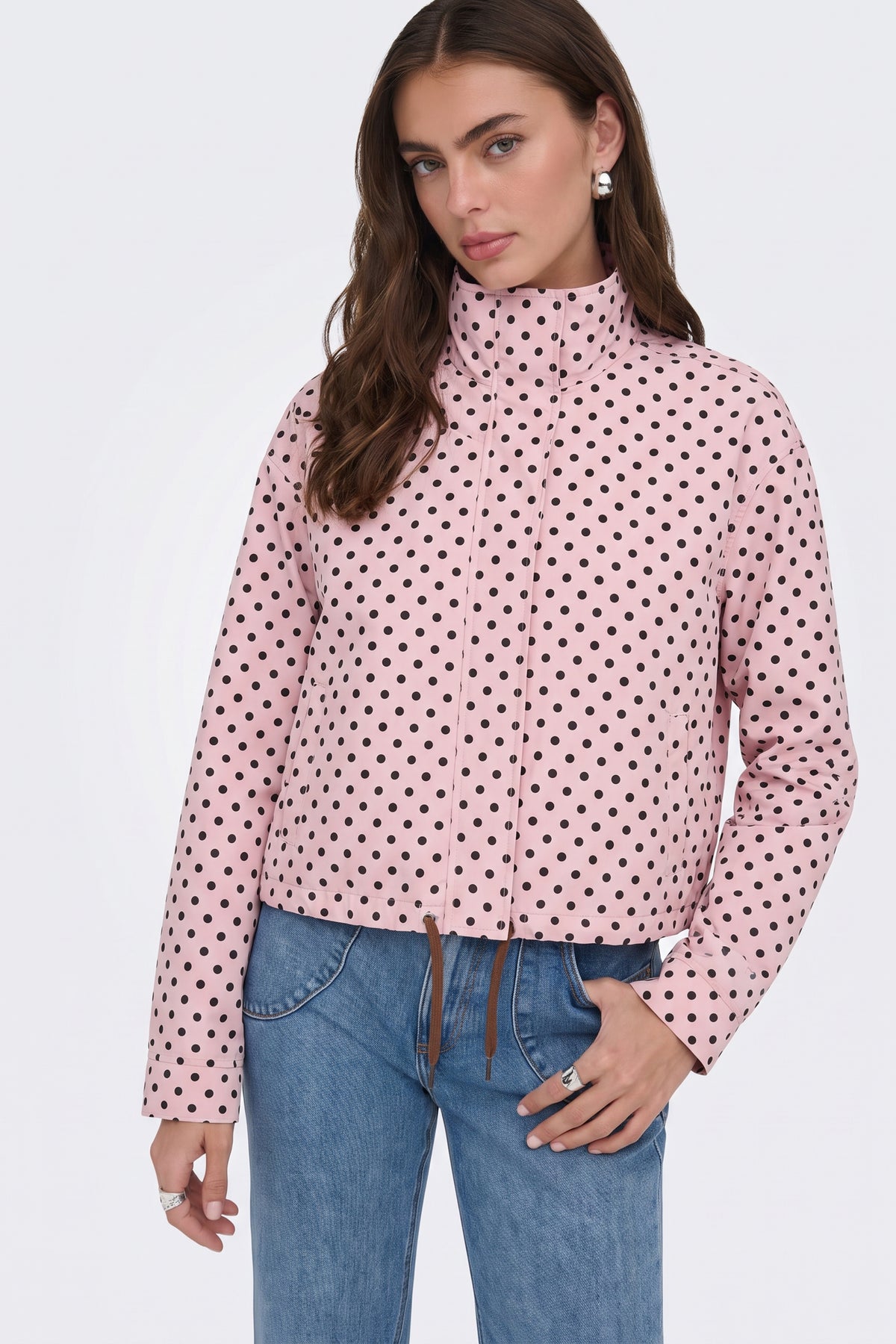 Pink polka dot jacket stand collar detail, on model