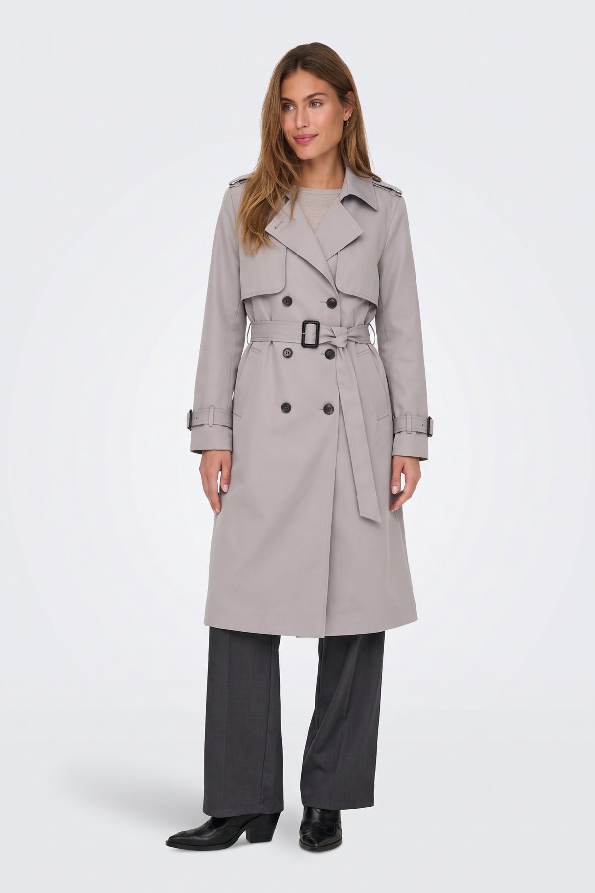 Grey long trench coat worn belted at the waist