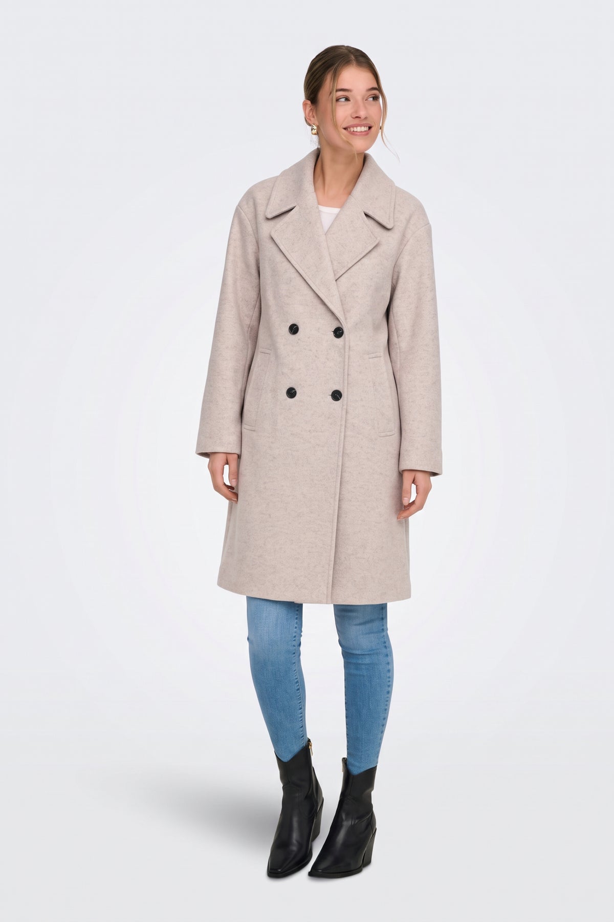 Light grey long coat with jeans and black ankle boots, full length