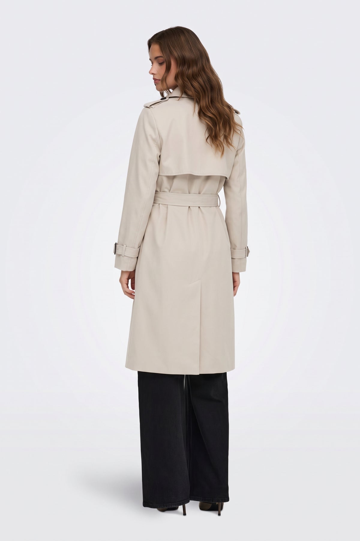 Cream long trench coat back view with storm flap