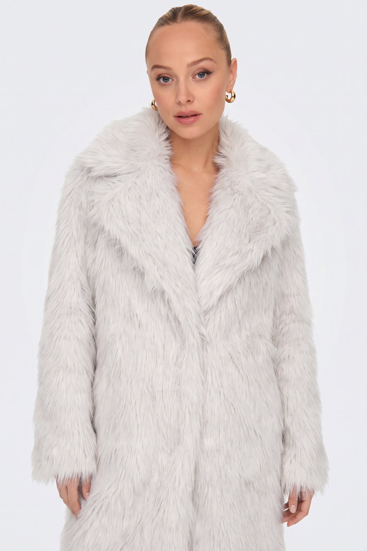 White longline faux fur coat on model, front view