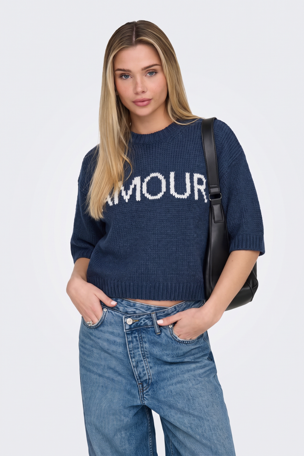 Navy cropped knit jumper with ribbed hem, on model