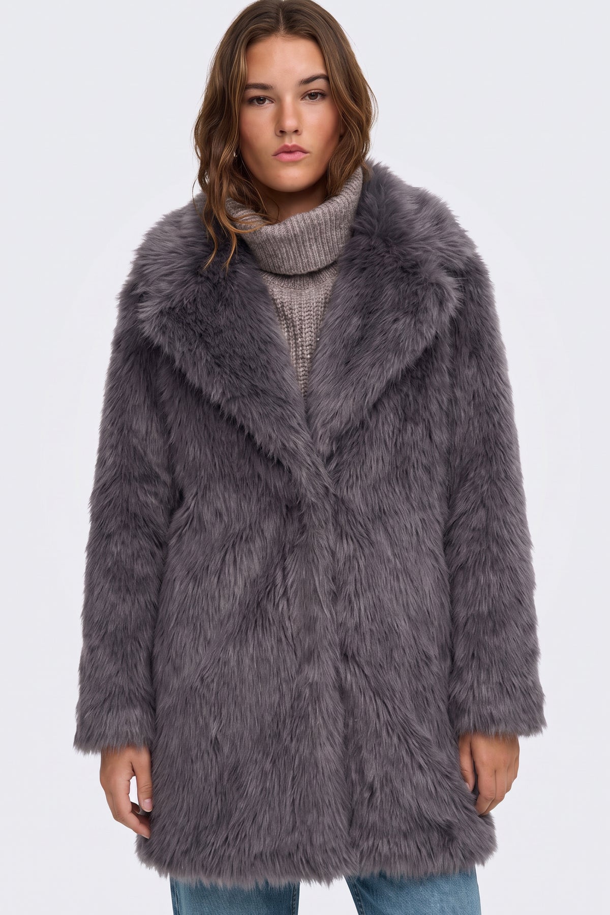 Grey longline faux fur coat on model, front view