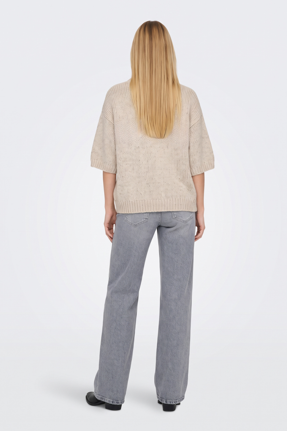 Beige short sleeve cropped jumper back view on model