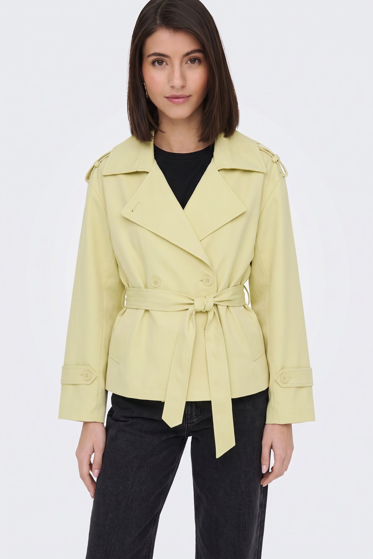 Yellow trench jacket lapel and belt detail