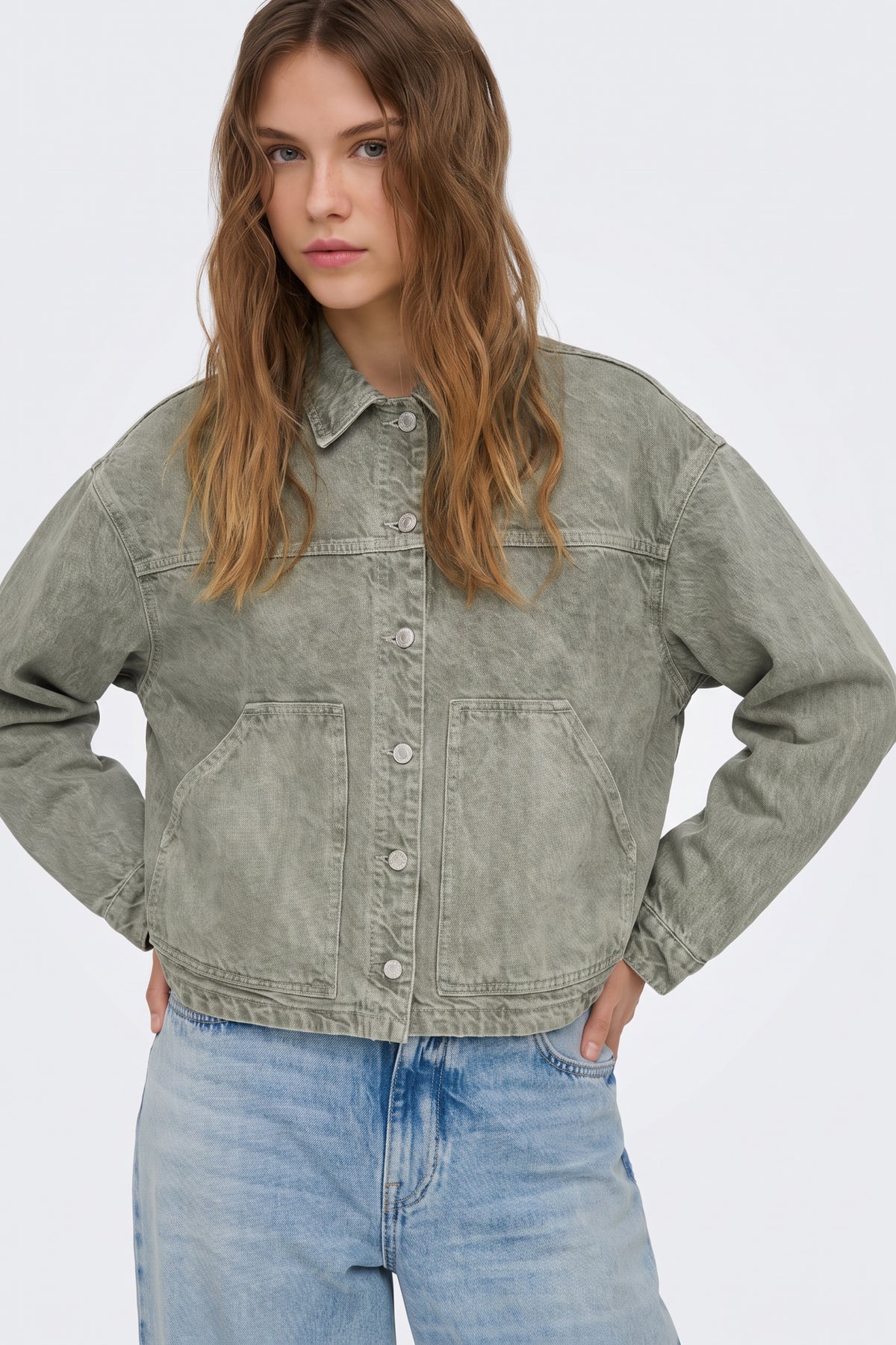 Green oversized denim jacket with patch pockets, on model