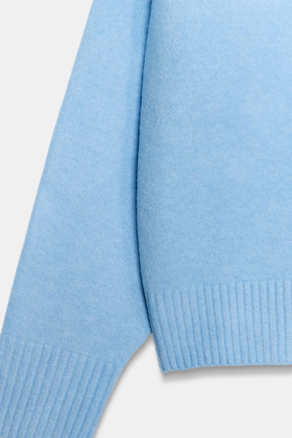 Light blue jumper ribbed cuff and cropped hem detail