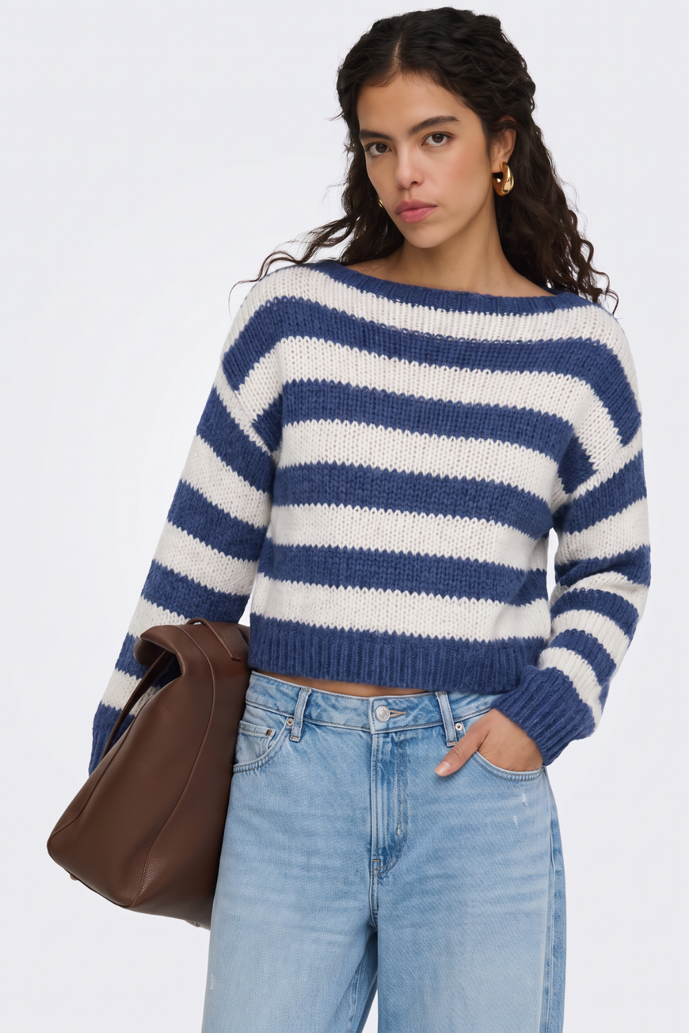 Blue striped jumper with wide boat neck, close-up on model