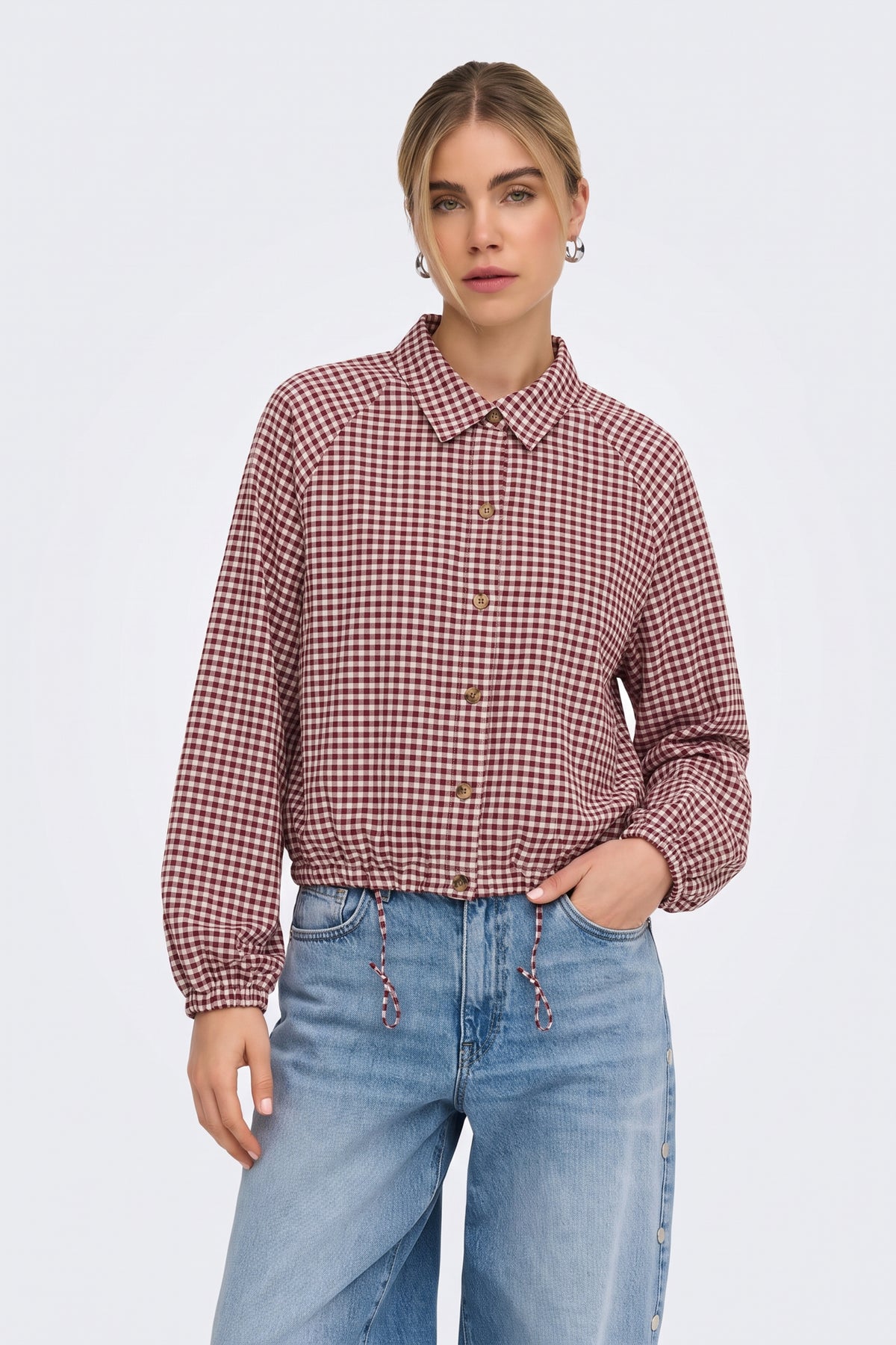 Burgundy gingham check jacket with light wash jeans, on model
