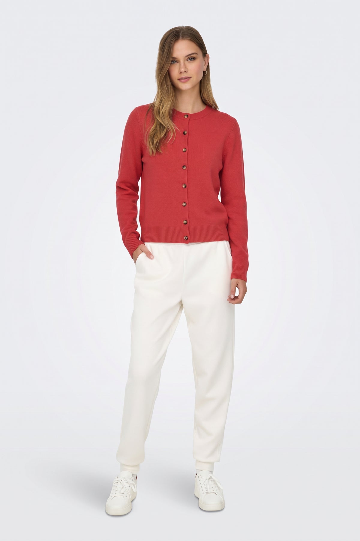 Red piece worn on model, side view