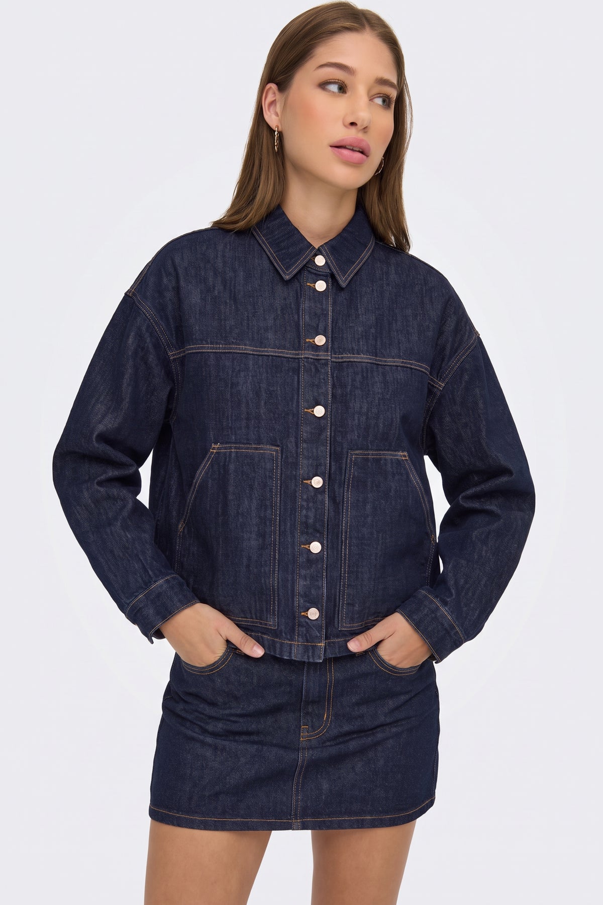 Dark blue denim jacket with matching denim skirt, on model